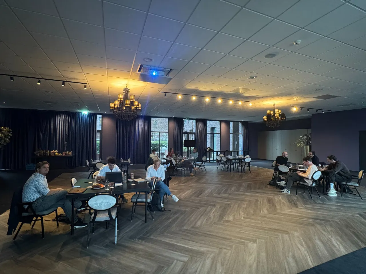 Participants working in groups during a TwoFeetUp hackathon.